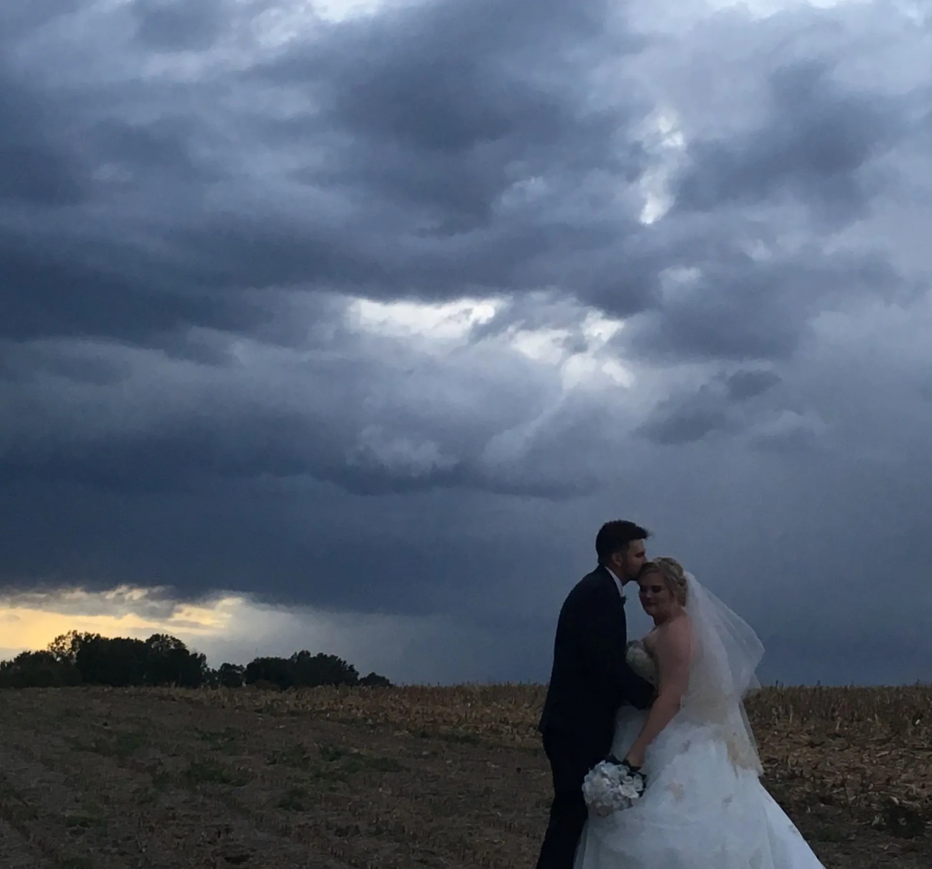 cloudy sky, bride and groom